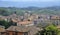 Scenic vista of a quaint village nestled amidst vast plains in Perugia, Italy