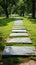 Scenic walkway on vibrant green grass, creating a peaceful atmosphere