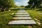 Scenic walkway on vibrant green grass, creating a peaceful atmosphere