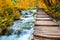 Scenic waterfalls and wooden path - Fall season