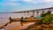 Scenic wide view of railway bridge across the Godavari river .