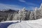 Scenic winding road in the Altai mountains on a Sunny frosty winter day. Altai Republic, Western Siberia