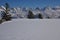 Scenic winter landscape with a mountain range covered in snow in Zurich, Switzerland