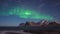 Scenic winter landscape with northern lights, Aurora borealis in night sky, Lofoten Islands, Norway