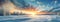 Scenic winter landscape panorama with snow and a sunset