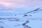 Scenic winter landscape with solitary farmhouses in the twilight, northern Iceland