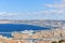A scenics aerial view of the city of Marseille, bouches-du-rhone, France with a cruise ship arriving at the port under a majestic