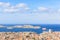 A scenics aerial view of the city of Marseille, bouches-du-rhone, France with a cruise ship leaving the port under a majestic