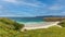 A scenics beautiful view of the Ceannabeinne Beach along the A838 touristic road near Durness in the Scottish Highland under a