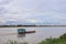 Scenics of the Mekong river in the cloudy day with cargo ship.