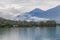 A scenics view of Embrun, Hautes-alpes, France old town with low white cloud with the lake (plan d\\\'eau)