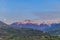 A scenics view of majestic snowy mountain summit (Les Orres) at dawn with a full moon, Hautes-alpes, France