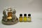 Scented lamp, Buda figures, candle, bottle of scented oil close-up. Bottles of oil.