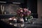 Scented Serenity: A Cluster of Roses and Lavender Candles on a Black Mat