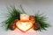 Scented wax candles, Christmas toy heart, cedar cones, cedar branch, Christmas garland, composition