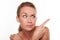 Sceptical woman pointing with her finger