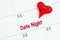 Scheduling your date night with a calendar with a red heart