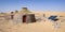 Schelter equipped with solar panels in the middle of the Desert