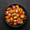 Schezwan Paneer in black bowl at dark slate background. Schezwan Paneer is indo-chinese cuisine dish