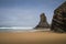 Schist rock formations standing on beach