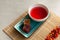 Schizandra tea on a bamboo mat. Selective focus. Traditional ancient  Korean drink is brewed from Chinese lemongrass berries. Used