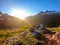 Schladming - Couple cooking dinner in the wilderness during the sunset