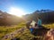 Schladming - Couple cooking dinner in the wilderness during the sunset