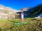 Schladming - Girl practising yoga by the alpine lake