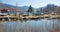 Schlierach river at early springtime. view to reversed boats and bavarian alps