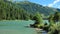 Schlierersee, Lungau Austria.Mountain lake and mountains covered with pine trees on blue sky background.Beautiful