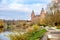 Schloss Johannisburg on the river Main with shore promenade in autumn in Aschaffenburg, famous historic city castle constructed of