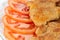 Schnitzels and sliced tomato, close-up