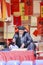 A scholar writes Chinese calligraphy characters at Temple of Literature