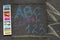 School, ABC and 123 sigh written with colored chalks on a pavement. Drawing Back to school on an asphalt. and vacation concept. Ed