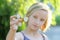 School aged girl playing with a gold fidget spinner. A popular trendy toy.