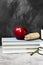 School attributes - books, colored pencils, notebook, apple on d