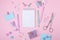School background with notebook and pastel colorful study accessories on pink background Back to school concept