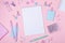 School background with notebooks and pastel colorful study accessories on pink background Back to school concept