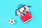School backpack with trainers and football ball on blue