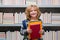 School boy with books in library. School kids. Child from elementary school. Pupil go study. Clever schoolboy learning