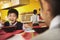 School boy eats noodles in school cafeteria