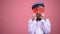 School boy in vintage clothes closing eyes with red hearts on Valentines holiday