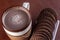 School breakfast, chocolate milk with round cocoa cookies.