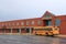 School Building with Bus