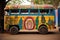 a school bus painted with diverse cultural motifs
