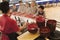 School cafeteria worker serves noodles to students