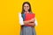 School child with book. Learning and education. Happy schoolgirl face, positive and smiling emotions.