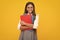 School child with book. Learning and education. Happy schoolgirl face, positive and smiling emotions.