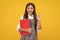 School child with book. Learning and education. Happy schoolgirl face, positive and smiling emotions.