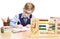 School Child Writing in Classroom, Education Clock and Abacus